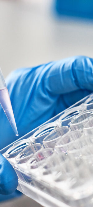 lab worker with sample tubes