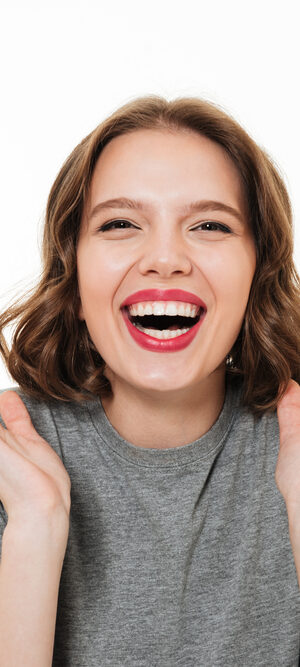 laughing woman in gray shirt
