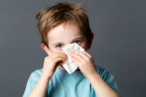 little boy with tissue