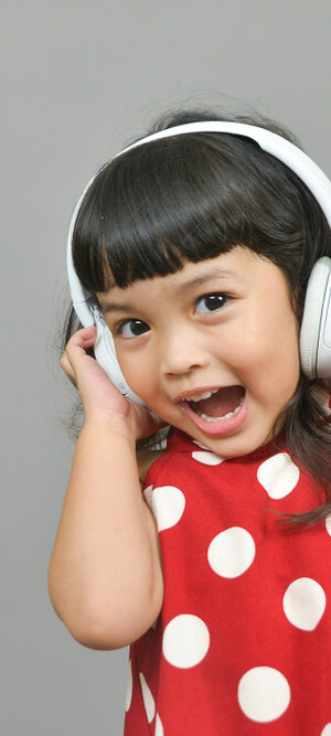 little girl with headphones