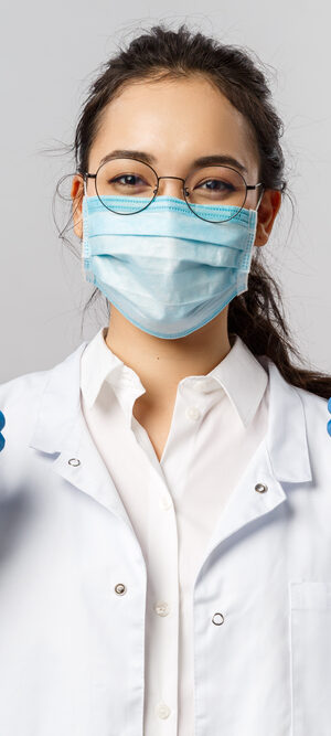 medical person giving thmbs up with mask