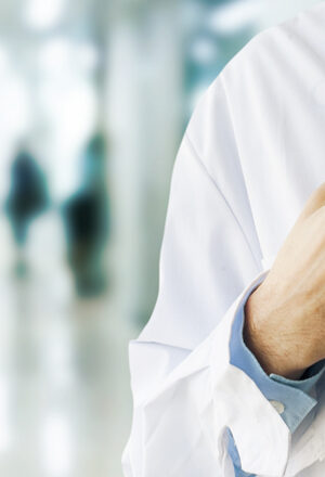 medical person with hands on stethoscope