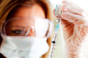 Medical worker preparing vaccine
