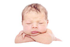 newborn baby with fat cheeks