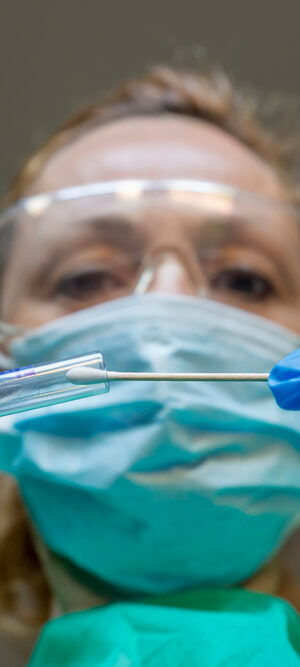 nurse with test swab and tube