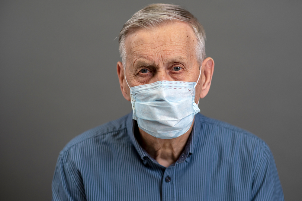 older man with mask