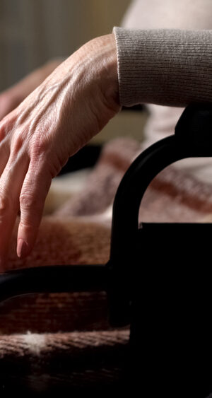 older person hand in wheelchair