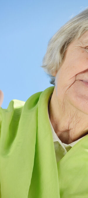 older woman giving thumbs up