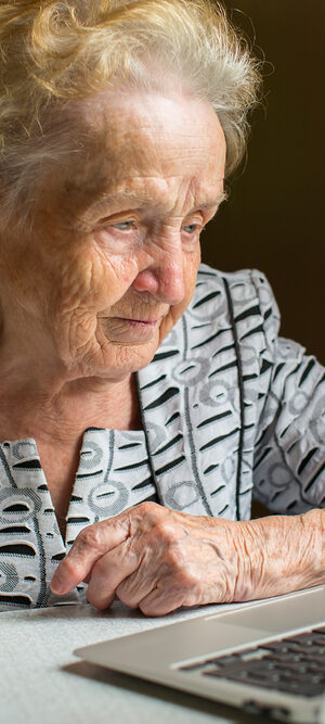 older woman using a laptop