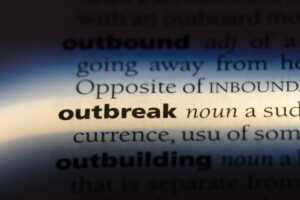 outbreak letters on dictionary page