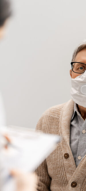 patient with nurse wearing mask