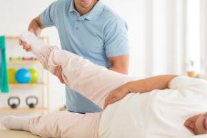 physical therapy worker and patient