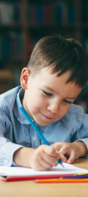 preschooler working at table