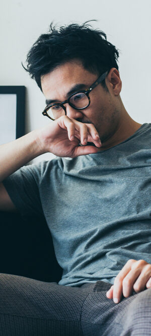 sad guy sitting on couch
