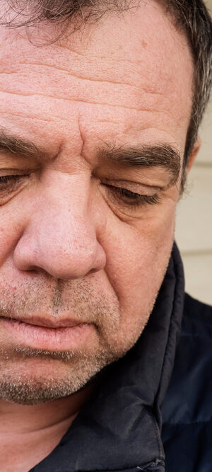 sad man with jacket