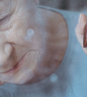 sad older woman with cane