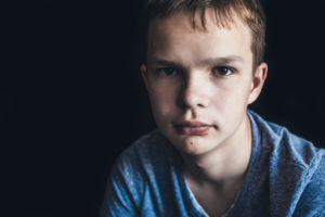 teen boy in blue shirt