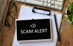 scam alert on tablet