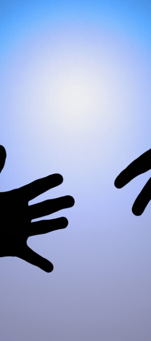 stretched hands with blue sky background