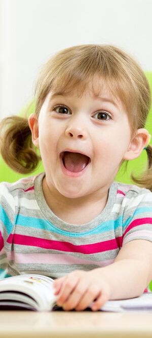 suprised little girl with books