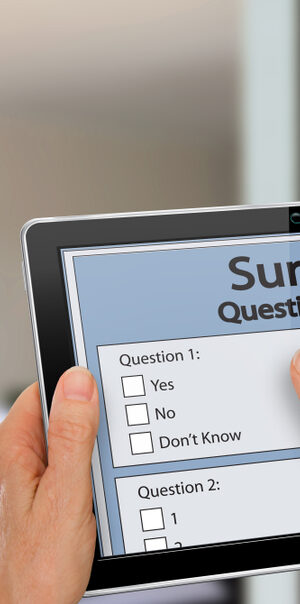 survey on tablet with hands