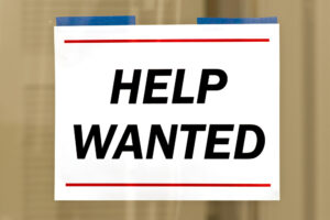 taped help wanted sign