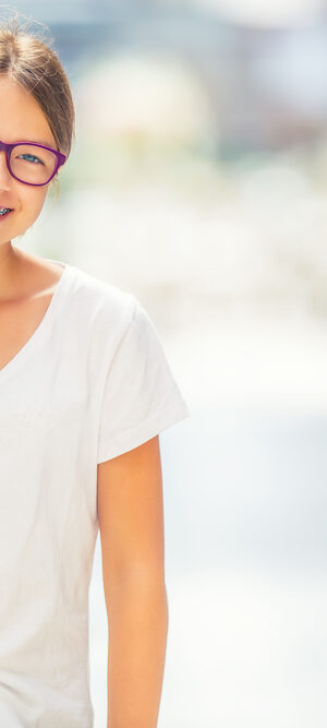 teen girl with braces and backpack