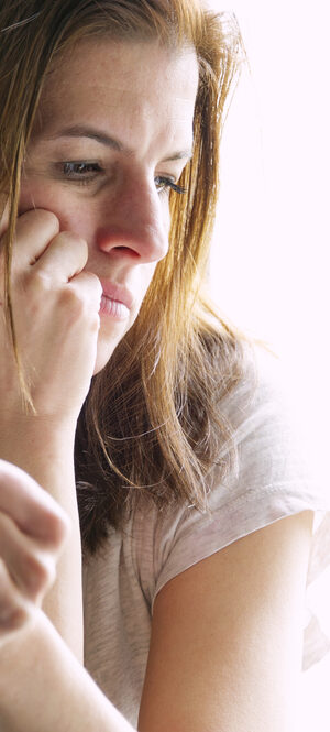 thoughtful woman holding coffee cup