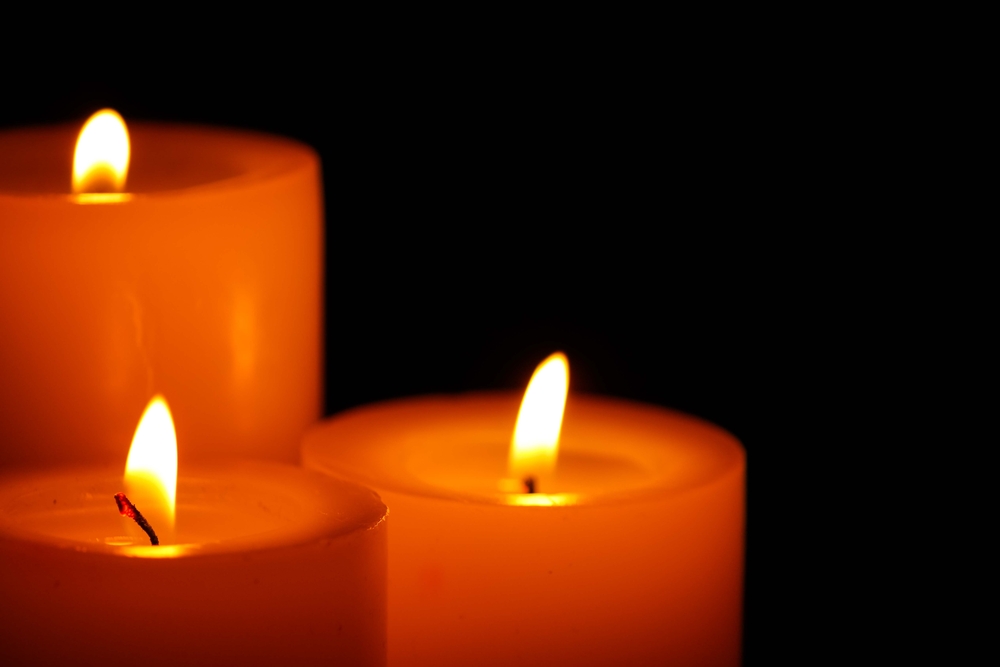 photo of three candles burning