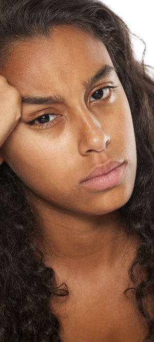 unhappy ethnic young woman