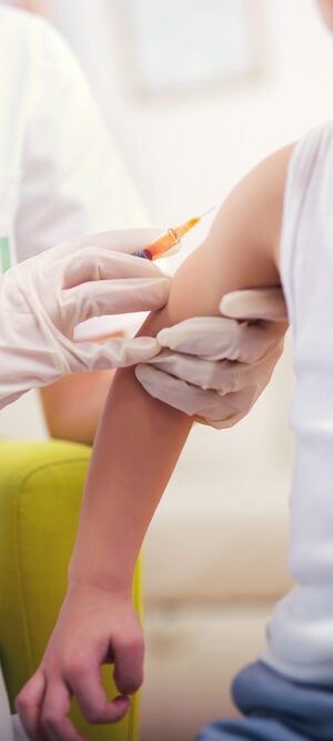 vaccine with small child in tank top