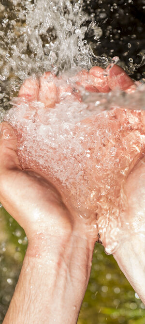 water outdoors in hands