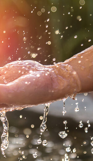 water splashing on hand