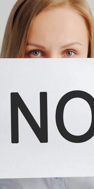 woman holding no sign