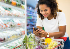 woman with phone at store