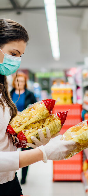 womand with face covering shopping