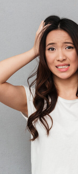 worried young woman with white shirt