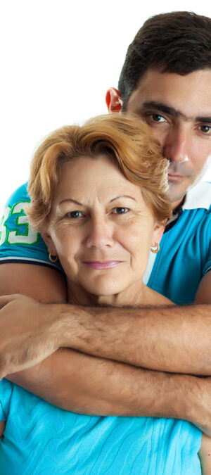 young man holding mom in hug