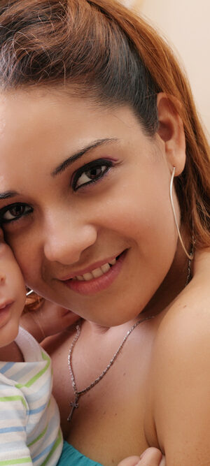 young mother holding newboard baby