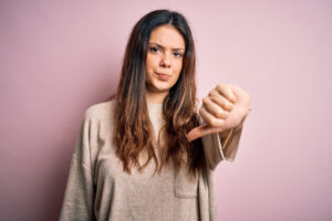 young woman giving thumbs down