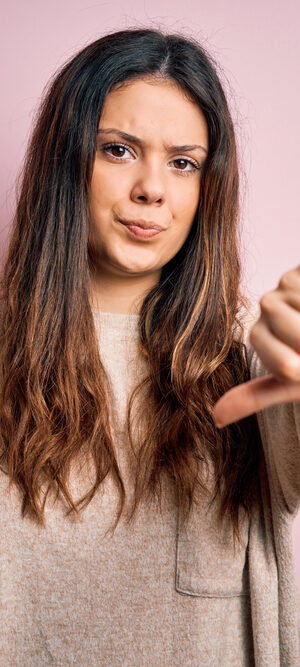 young woman giving thumbs down