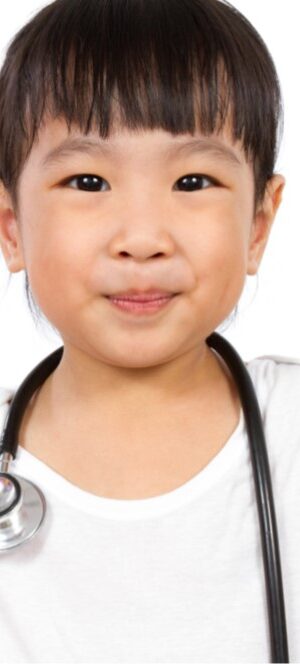 Child wearing stethoscope
