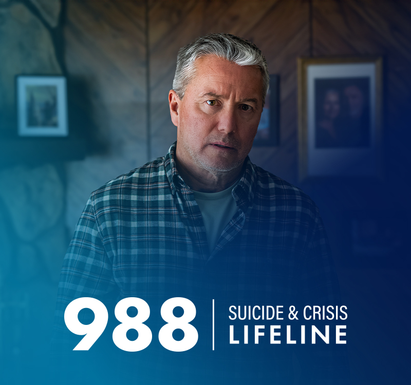 The 988 Suicide & Crisis Lifeline logo overtop of the image of a man